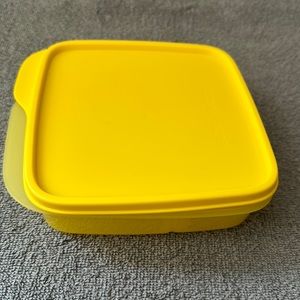 Yellow tupperware lunch container